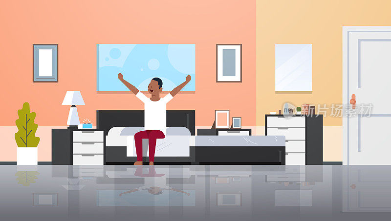 man stretching arms waking up in the morning african american guy sitting on bed after getting up satisfaction concept modern apartment bedroom interior flat horizontal